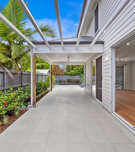 Narrow block home designed with airflow and indoor-outdoor living in mind