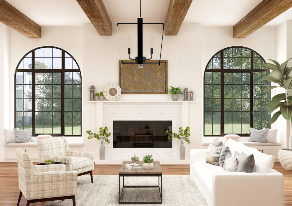 A bright, spacious living room with white walls, wood beams, arched windows, and a central fireplace.